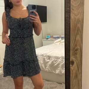 small mini polka dot dress withh ruffle sleeves and a front tie